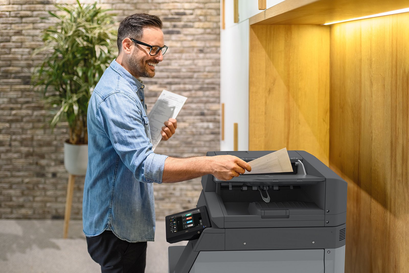 Man using a Sharp Printer at the office