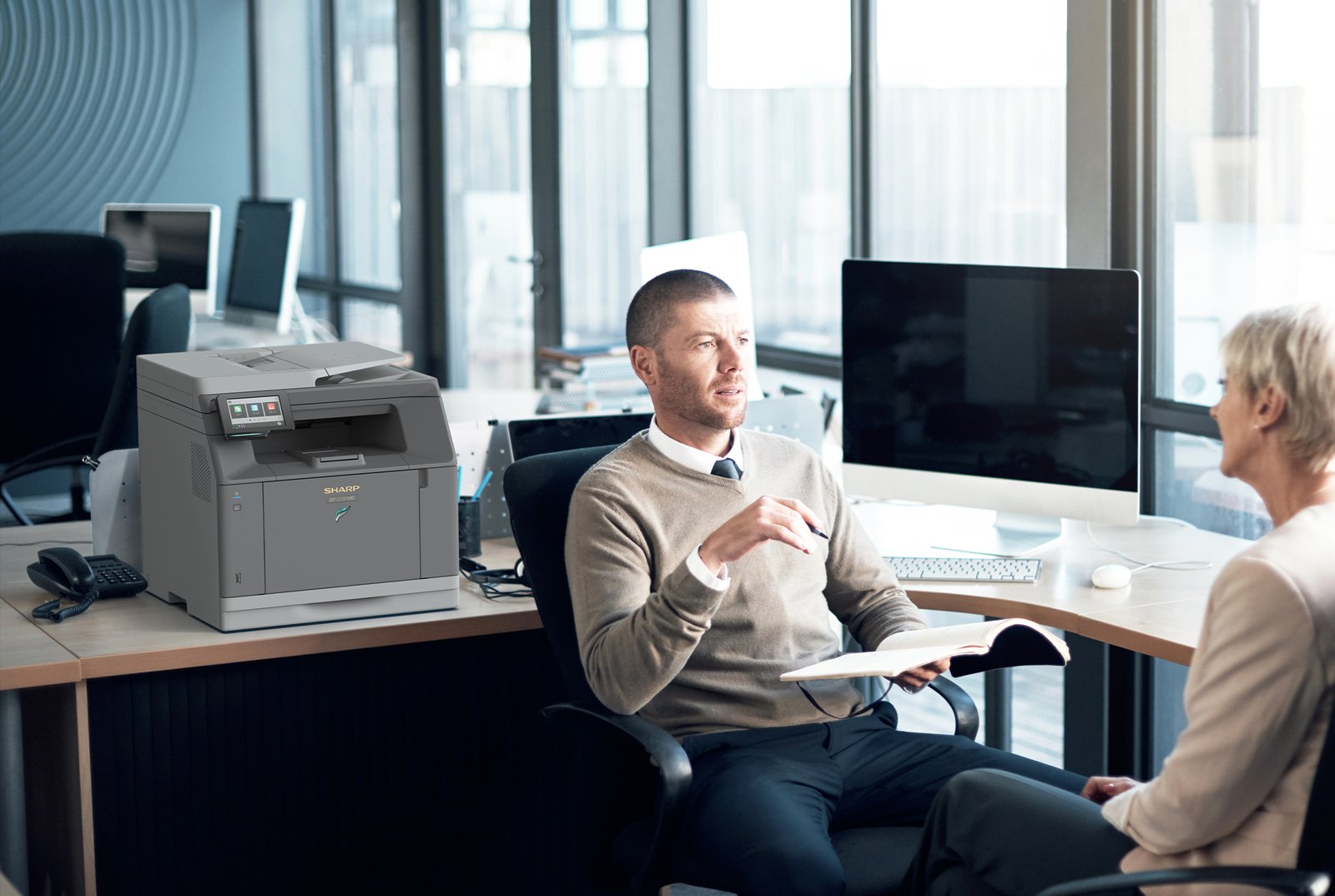 Office workers having a discussion